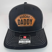 Richardson 112 patch hat in black with white mesh, featuring a laser-engraved leather patch reading "Hoochie Daddy" on the front panel.