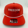 Red cap with 'FREEDOM' text on a white background