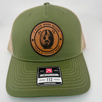 Richardson 112 trucker hat with custom laser engraved leather patch featuring I Flick More Bean Than a Coffee Shop logo, Army Olive and Tan color scheme