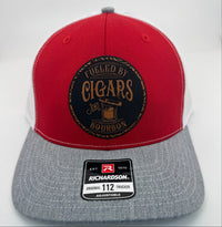 Richardson 112 trucker hat with custom laser engraved leather patch featuring Fueled by Cigars and Bourbon logo, Red, White, and Heather Grey scheme