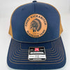Navy Richardson 112 hat with carmel mesh back, featuring a laser-engraved leather patch that reads “Chief Kickabitch from the Slapahoe Tribe.”