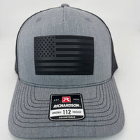 Richardson 112FP trucker hat with custom laser engraved leather patch featuring The Black USA Flag, Heather Grey and Black Mesh color scheme