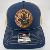Richardson 112 trucker hat with custom laser engraved leather patch featuring Against All Enemies, Foreign and Domestic logo, Navy and Khaki color scheme