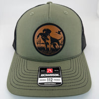 Richardson 112FP trucker hat with custom laser engraved leather patch featuring BirdDog logo, Loden Green and Black Mesh Color scheme