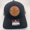 Richardson 112 trucker hat with custom laser engraved leather patch featuring Overtime Hours, Working All Day For Bullshit Pay logo, Black Front and Black to White Fade Mesh color scheme