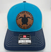 Richardson 112 trucker hat with custom laser engraved leather patch featuring Save the Turtles, Hit it Raw logo, Blue Teal, Birch, and Navy color scheme