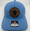 Richardson 112 trucker hat with custom laser engraved leather patch featuring Save the Turtles, Hit it Raw logo, Columbia Blue and White color scheme